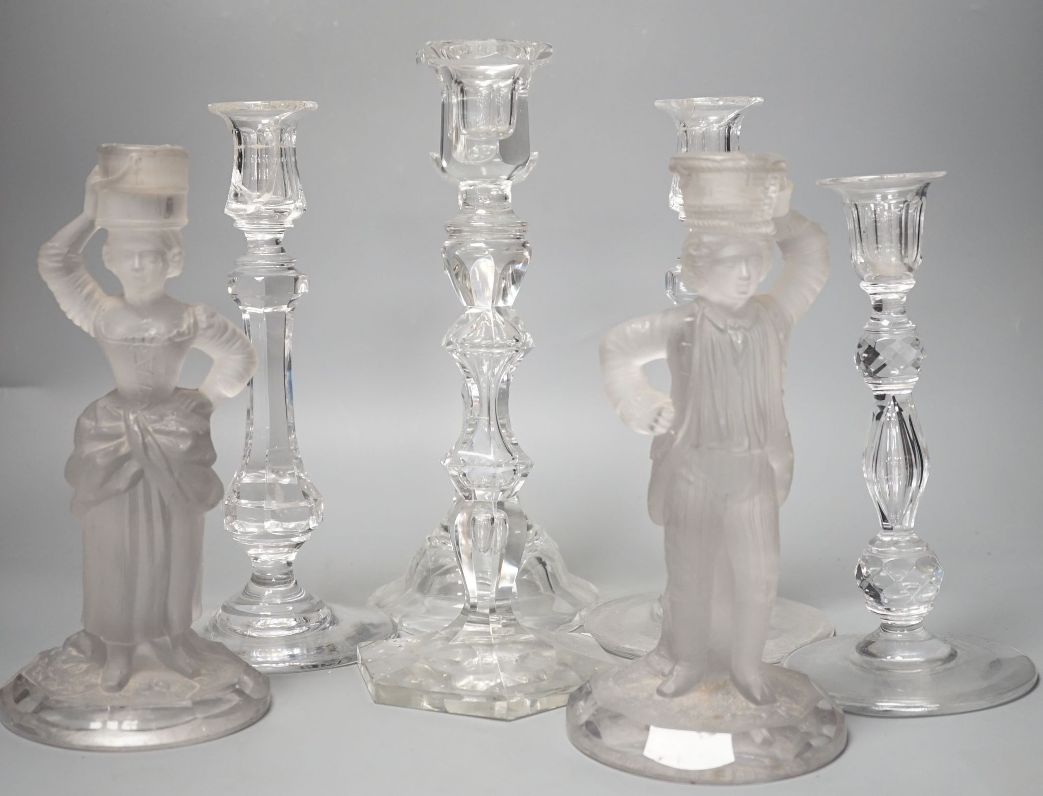 Five various cut glass candlesticks, a pair of John Ford, Holyrood Glass Works, Edinburgh figural frosted glass candlesticks and a lustre drop bag chandelier